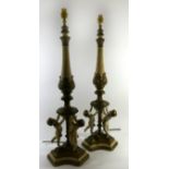 A pair of 19th Century style painted metal figural table lamps Modelled with three cherubs