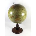 An early 20th Century terrestrial table globe Raised on wooden plinth base with inset compass,
