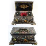 A large Victorian mahogany papier mache tea caddy Of waisted form, painted and gilded with birds