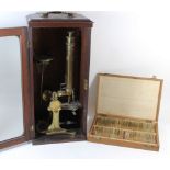 A 19th Century brass microscope By G Lowden Opticians Dundee, height 41cm, together with a