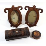 A pair of Edwardian inlaid mahogany photograph frames Each of shaped oval form, height 19cm, burr