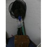 A mixed lot of fishing tackle to include wicker fishing basket, rods, nets etc.