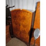 A mid 20th Century walnut two door gents wardrobe