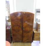 A mid 20th Century burr walnut two door wardrobe