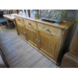 A Victorian pine dresser base, three drawers over three cupboard doors CONDITION REPORT Height 94cm,