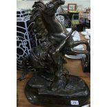 A reproduction bronzed metal Marley horse set on an oval plinth base CONDITION REPORT It is set on a