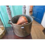 A substantial 19th Century brass two handled tub, a 19th Century copper haystack measure,