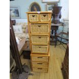 A pair of contemporary hardwood chests each with an arrangement of sliding wicker trays (2)