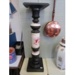 An early 20th Century ebonised and ceramic pedestal plant stand