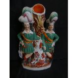 A 19th Century Staffordshire figural spill vase Formed as two Scottish gentleman and a Spaniel by