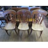 A set of three Victorian alder wood kitchen chairs with pierced splat backs