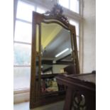 A Louis XVI style giltwood over mantel mirror, with a moulded foliate crest above a shaped