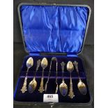A case of early 20th Century Chester hallmarked fancy silver teaspoons and accompanying tongs