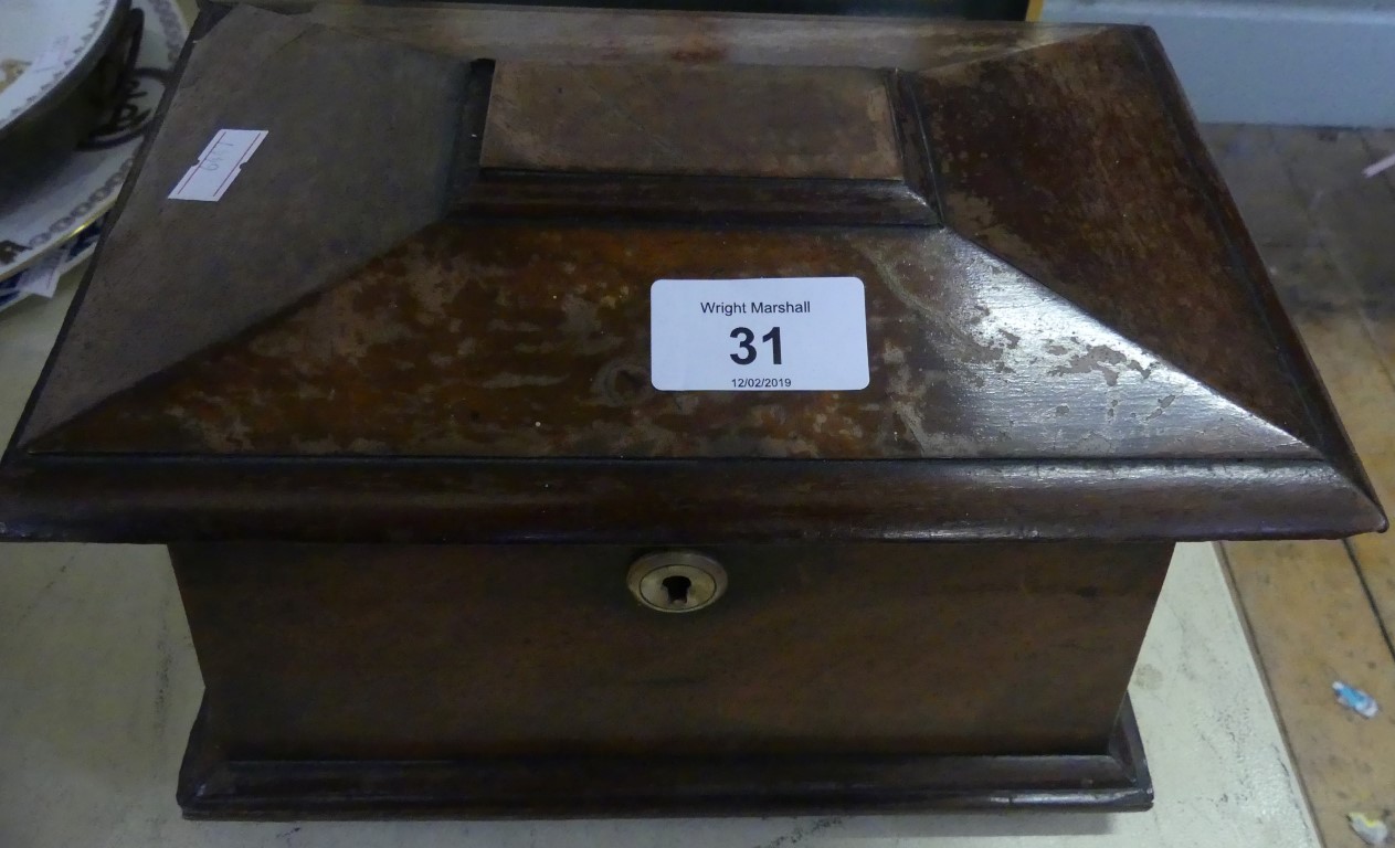 A 19th Century mahogany sarcophagus formed tea caddy with two section interior.