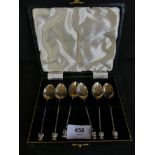 A cased set of six teaspoons with Lincoln imp finials bearing Birmingham hallmarks
