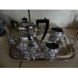 A silver-plated four piece tea and coffee service, with accompanying tea strainer and double handled