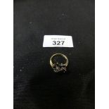 An 18ct gold sapphire and diamond dress ring, designed as a Vari-size brilliant cut diamond line