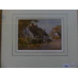 J. W. Milliken - Lady feeding ducks outside thatched cottage, watercolour, signed lower right,