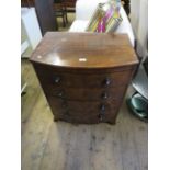 A Georgian mahogany bowfront chest of small proportions, with splayed bracket feet.