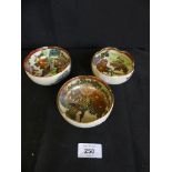 Three Japanese Satsuma bowls decorated with floral detail and gilt highlights