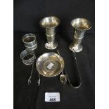 A mixed lot of various silver wares to include Georgian sugar nips, various napkin rings, small