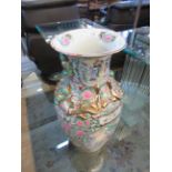 A Chinese floor standing Famille Rose pattern vase