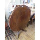 A mid 19th Century mahogany pedestal tilt top centre table