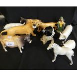 A mixed lot of various Beswick items to include lions, pigs, cows, sheep, magpie, further Doulton