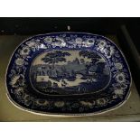 A 19th Century blue and white oval meat plate decorated in wild roses pattern.