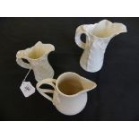 A Leeds Pottery jug, with entwined handle, together with two Royal Worcester leaf formed jugs,