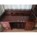 A 1930's mahogany roll top twin pedestal office desk