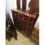 A small Georgian mahogany floor standing corner cabinet with two frieze drawers over two doors