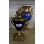 A late 19th/early 20th Century Continental gilt metal and porcelain oil lamp, together with a