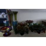 A large collection of Carnival glass, to include three flared lip vases, a pair of blue tinted