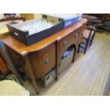A 19th Century mahogany breakfront sideboard With central drawer and two side doors fitted with