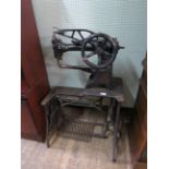 An early 20th Century industrial Singer treadle leather sewing machine