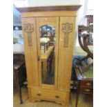 A late Victorian satin walnut single door wardrobe