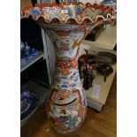 A large late 19th/20th Century Japanese floor standing vase of baluster form decorated with panels