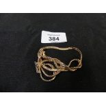 A 9ct gold necklace The flat curb link chain with push piece clasp, length 49cm, weight approx. 12.