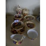 A collection of Aynsley Orchard Gold china wares comprising two cups and saucers, small double