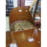 A 20th Century oak doll's tub chair with hinged upholstered seat, height 48cm