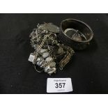 A selection of silver and white metal jewellery To include bangles, bracelets, brooches etc.