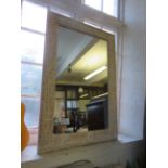 A contemporary painted hardwood rectangular wall mirror