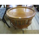 A contemporary hardwood tray top oval glazed bijouterie cabinet