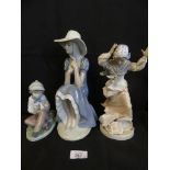 A group of three various Nao figures, Boy with bird, Seated young lady and lady on a windy day (3)