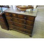 A Georgian mahogany chest of two short and three long drawers raised on bracket feet CONDITION