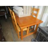 A good quality modern oak refectory style dining table and six accompanying rush seated chairs