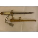 A German Naval Officers dagger, mid 20th Century, the straight double fullered double edged blade,