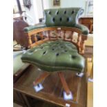 A modern green leather revolving captains chair