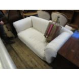 A late 19th/early 20th Century drop end sofa with pale loose covers CONDITION REPORT No castors on